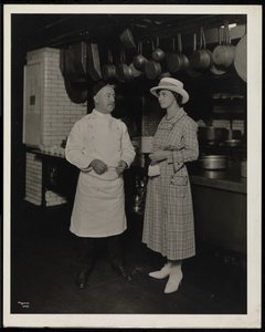 Chef Leoni and Miss Selley of Toronto in the Kitchen of the Hotel Commodore